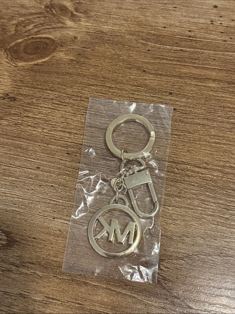 Michael Kors light gold MK Circle Logo bag charm
